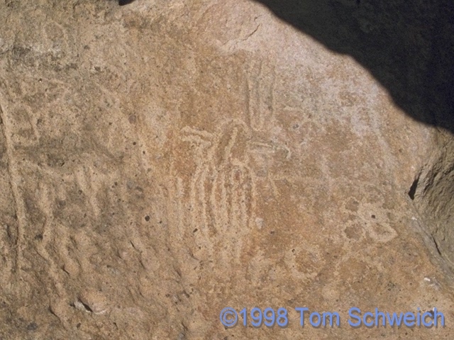 Petroglyphs inside the hollowed-out boulder.