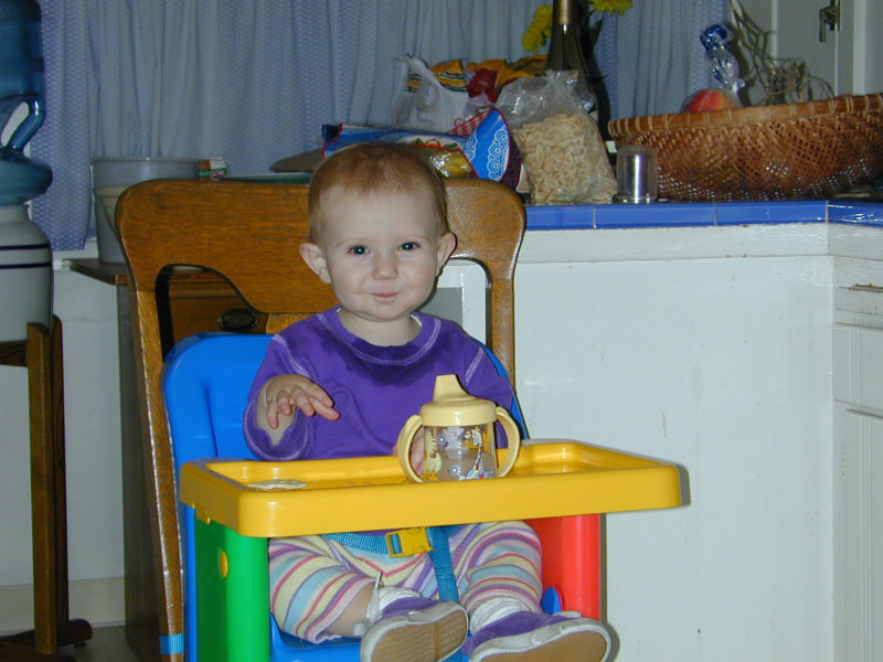 Simone playing in Granma's kitchen.