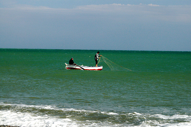 Fishermen placing their nets.