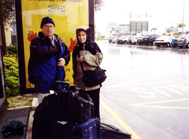 Waiting for the bus in the rain.