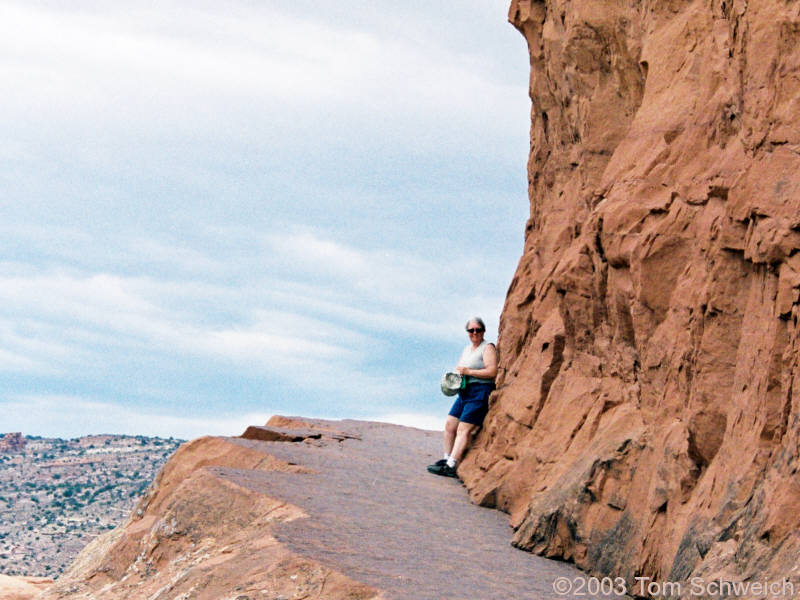 Cheryl rests on the trail to Delicate Arch.